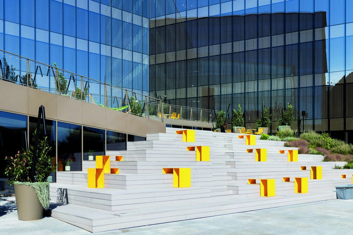 Custom planters integrated into a terrace with stepped seating